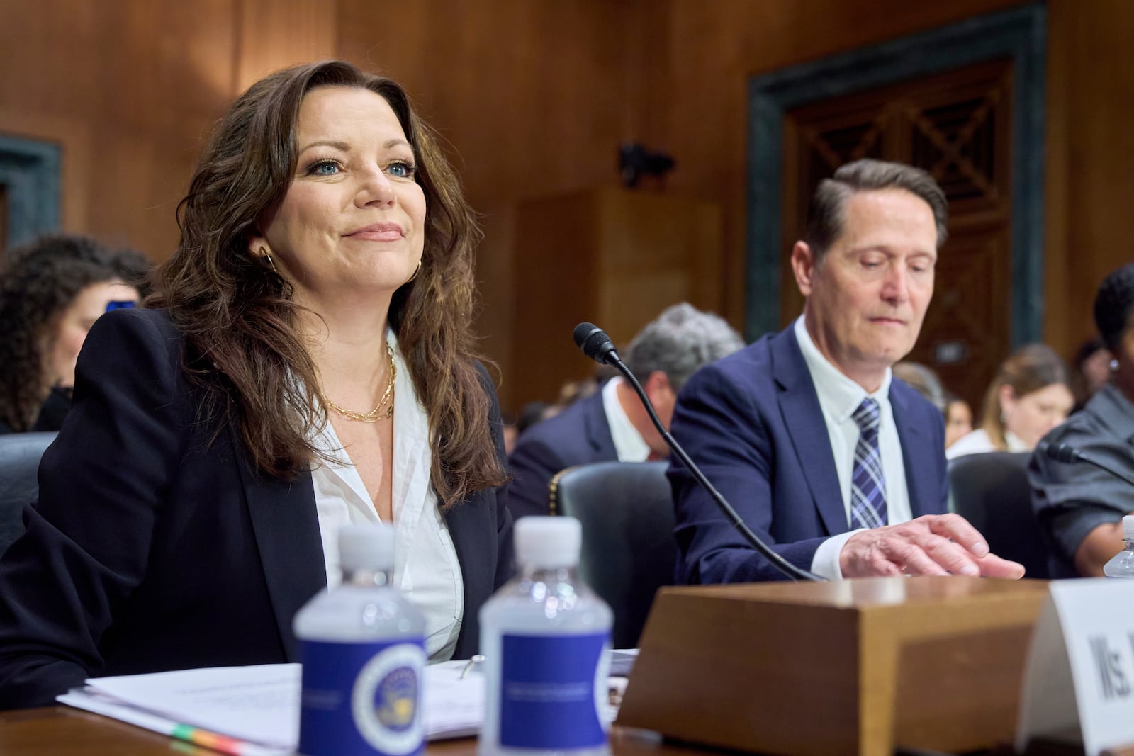 Country singer Martina McBride, left, and Mitch Glazier, CEO of the Recording Industry Association of America, attend a Senate Judiciary Subcommittee on Privacy, Technology, and the Law hearing about AI deepfakes, Wednesday, May 21, 2025, in Washington. (AP Photo/Jacquelyn Martin)