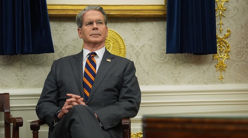 Treasury Secretary Scott Bessent listens as President Donald Trump talks after meeting with New York City Mayor-elect Zohran Mamdani in the Oval Office of the White House, Friday, Nov. 21, 2025, in Washington. (AP Photo/Evan Vucci)