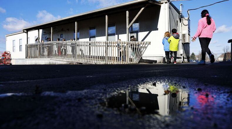 A recent district facilities committee meeting of the Lakota Board of Education saw officials warn board members that decisions on how to handle the expanding enrollment, which now has the 17,800-student school system ranked 8th largest in Ohio, need to be addressed. Lakota’s Cherokee Elementary’s growing enrollment and lack of classroom space has forced the school to use module or portable classrooms (pictured) on its grounds as a stop-gap measure for overcrowding. FILE