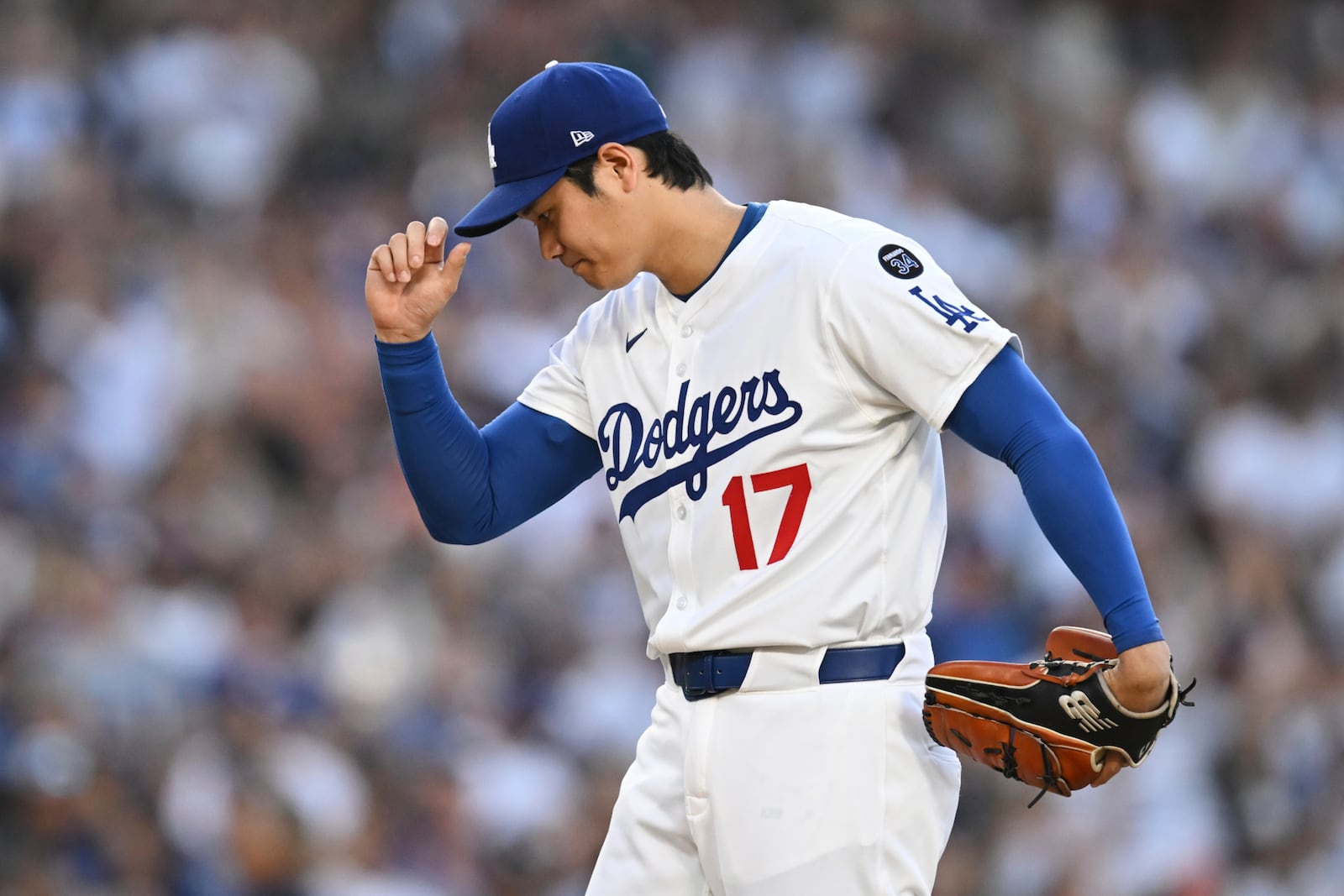 Los Angeles Dodgers starting pitcher Shohei Ohtani prepares to pitch during the first inning of a baseball game against the San Diego Padres, Monday, June 16, 2025, in Los Angeles. (AP Photo/Kyusung Gong)
