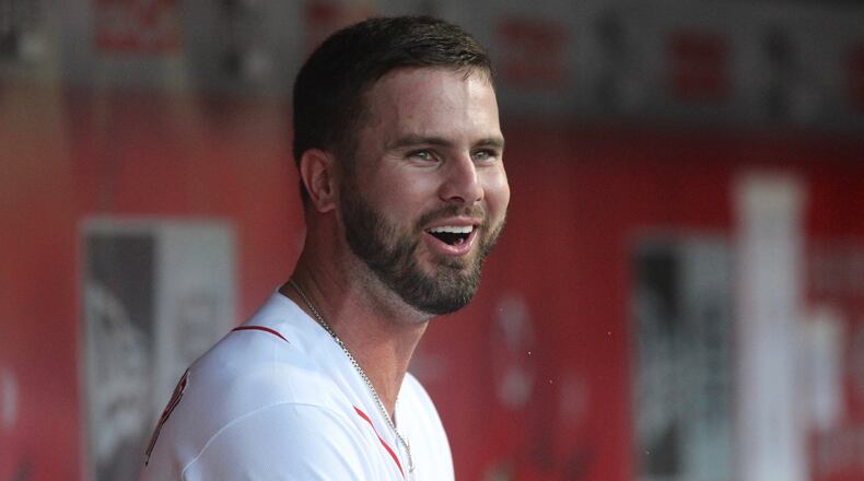 The Reds’ Jesse Winker smiles in the dugout during a game against the Brewers on Thursday, June 28, 2018, at Great American Ball Park in Cincinnati. David Jablonski/Staff