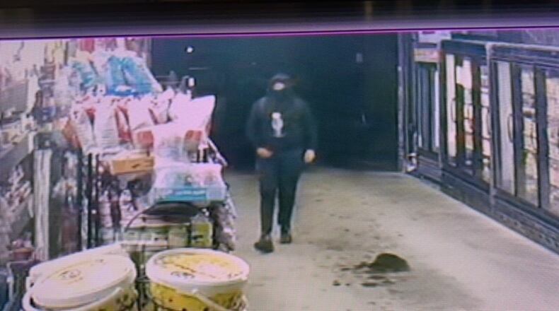 Store security photos were released Monday by Oxford Police of an armed robbery Saturday at Red Ox Drive Thru. SUBMITTED