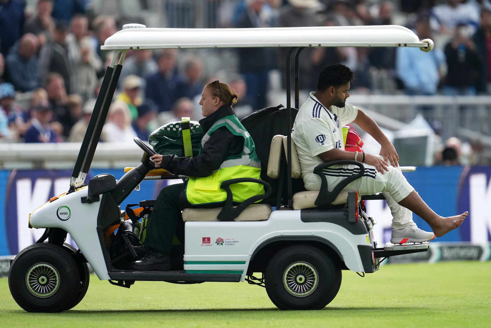 India's Rishabh Pant driven off the field after getting hurt during the fourth cricket test match between England and India at Emirates Old Trafford, Manchester, England, Wednesday, July 23, 2025.(AP Photo/Jon Super)