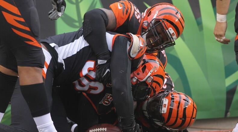 CINCINNATI, OH - OCTOBER 29: Carlos Dunlap #96, Vontaze Burfict #55 and Dre Kirkpatrick #27 of the Cincinnati Bengals celebrate a touchdown during the game against the Indianapolis Colts at Paul Brown Stadium on October 29, 2017 in Cincinnati, Ohio. The Bengals defeated the Colts 24-23. (Photo by John Grieshop/Getty Images)