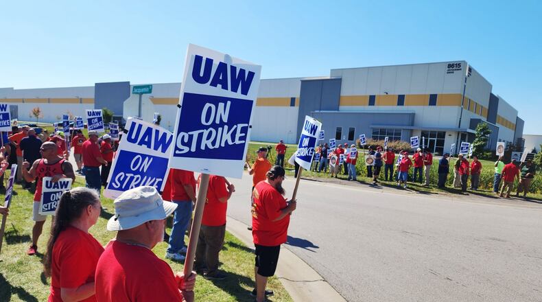 Members and supporters of Dayton's AFL-CIO union joined striking UAW Local 674 workers on the picket line in solidarity Tuesday, Oct. 3, 2023 West Chester Twp. The UAW 674 members are on strike at the General Motors Parts Distribution Center on Jacquemin Drive in West Chester Twp. NICK GRAHAM/FILE
