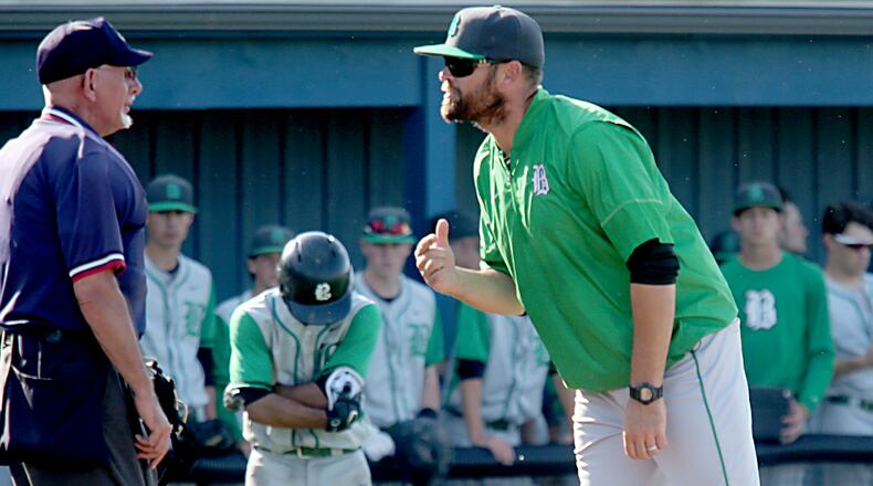 Badin baseball coach Brion Treadway discusses a call with the home-place umpire during a Division II sectional final against Chaminade Julienne at Miamisburg on May 18, 2017. JOURNAL-NEWS FILE PHOTO