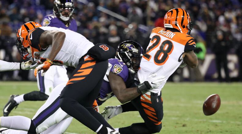 BALTIMORE, MD - DECEMBER 31: Running back Joe Mixon #28 of the Cincinnati Bengals fumbles the ball in the second quarter against the Baltimore Ravens at M&T Bank Stadium on December 31, 2017 in Baltimore, Maryland. (Photo by Rob Carr/Getty Images)