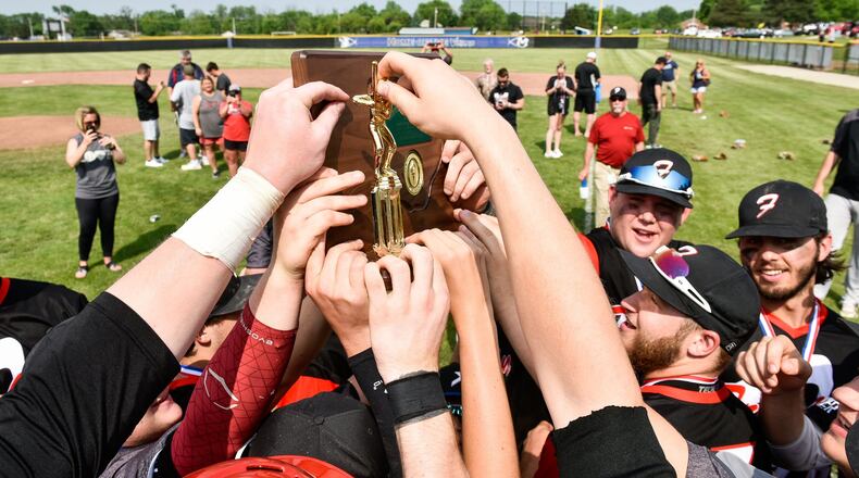 Franklin celebrates its Division II district baseball championship Friday afternoon after defeating Fenwick 11-2 at Miamisburg’s Toadvine Field. NICK GRAHAM/STAFF