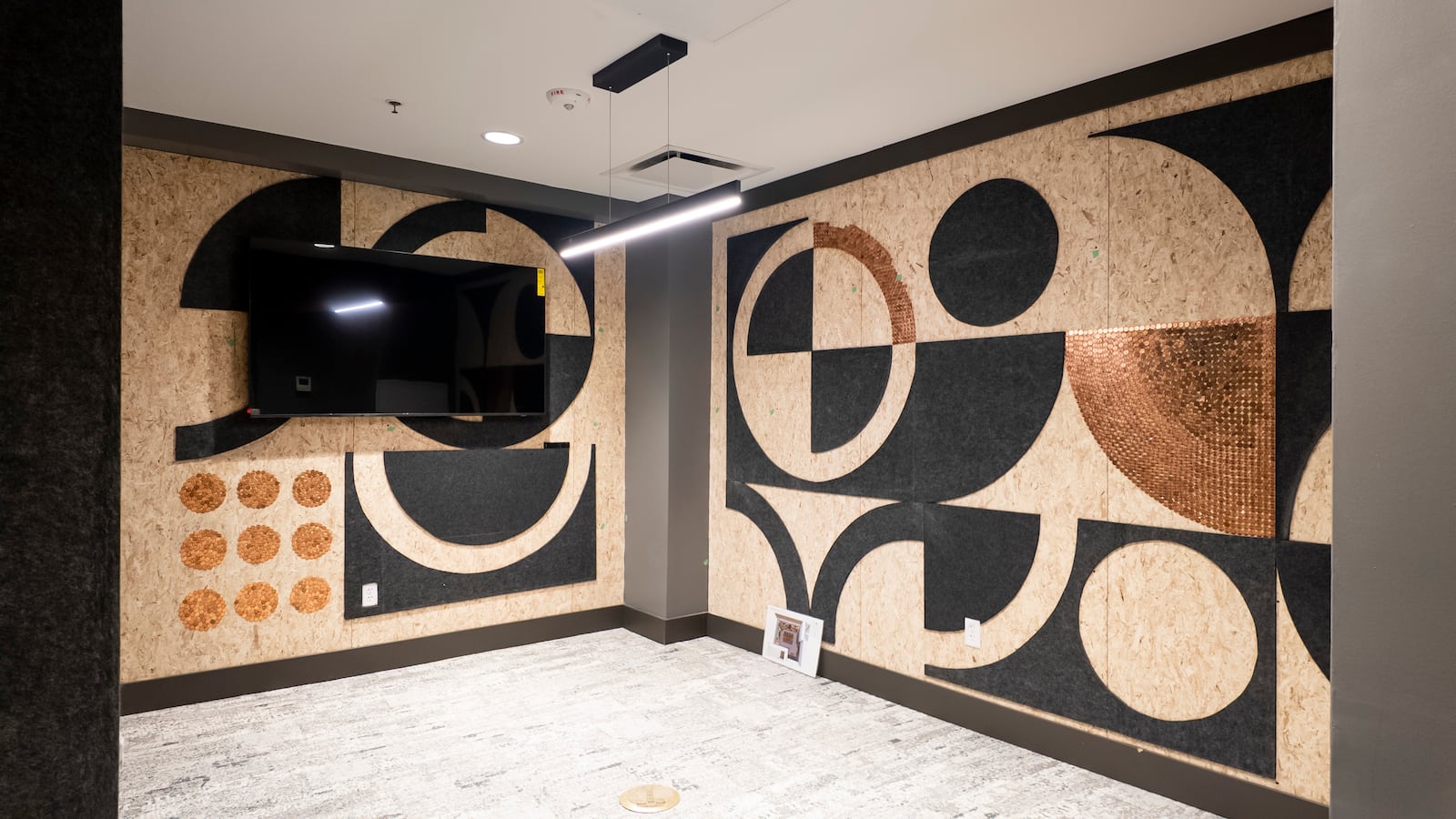 Pictured is the Copper Room, designed for podcasting. This is one of several unique rooms at the COhatch Hamilton, which construction continues at the former Second National Bank building on High Street. The building will feature coworking spaces, meeting and event areas, a cocktail lounge and more. NICK GRAHAM/STAFF