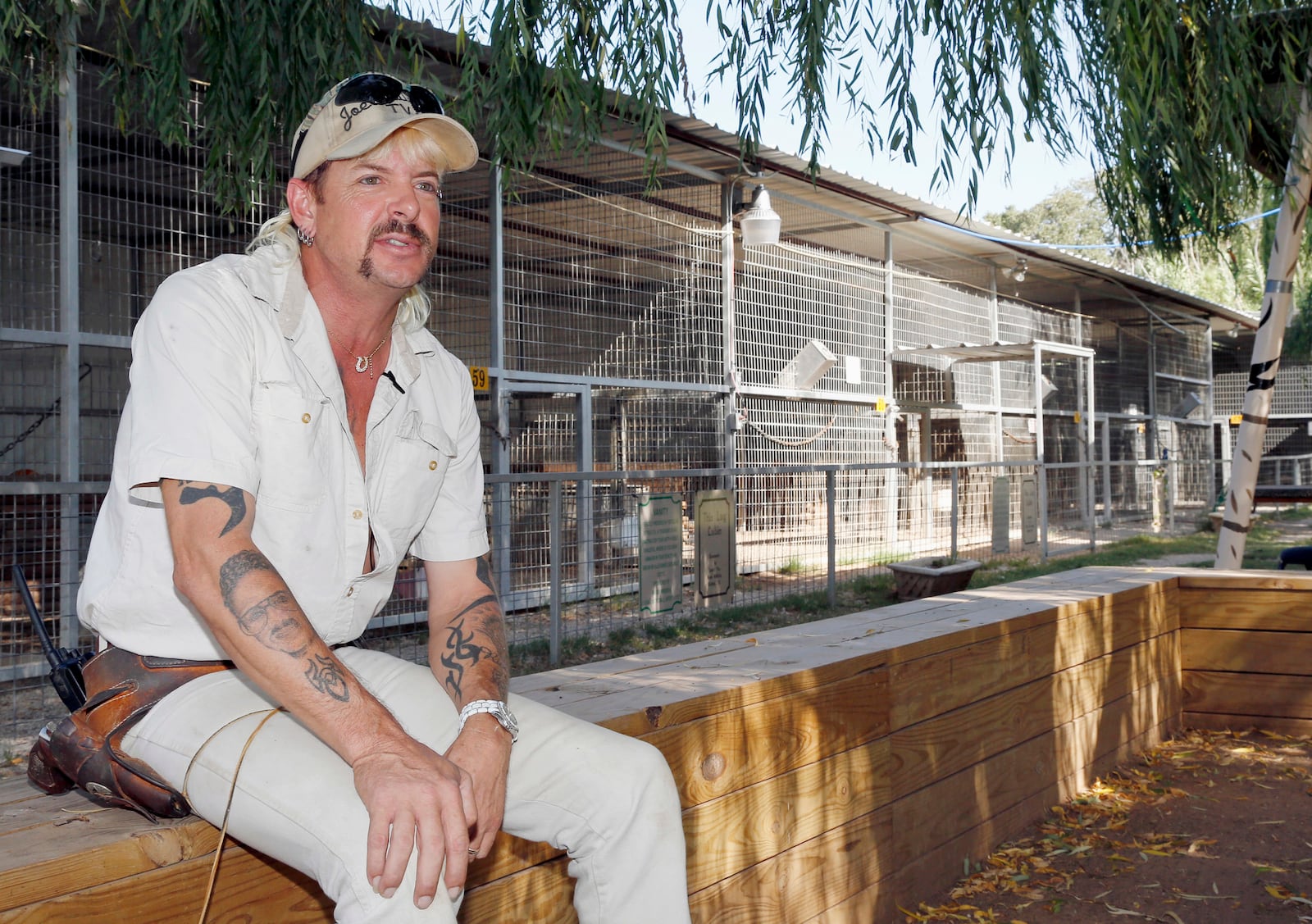 FILE - Joseph Maldonado answers a question during an interview at the zoo he runs in Wynnewood, Okla., on Aug. 28, 2013. (AP Photo/Sue Ogrocki, File)