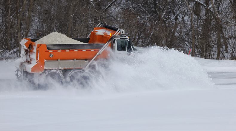 A Butler County Engineer's Office snow plow clears snow off of Elk Creek Road Friday, Feb. 4, 2022. NICK GRAHAM/STAFF