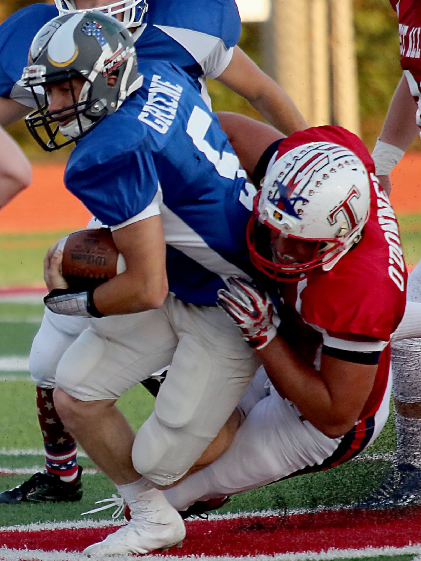 The West’s Andrew O’Donnel of Talawanda brings down East quarterback Tristan Greene of Blanchester on Thursday night during the Southwestern Ohio Football Coaches Association Ron Woyan East-West All-Star Game at Kings. CONTRIBUTED PHOTO BY E.L. HUBBARD