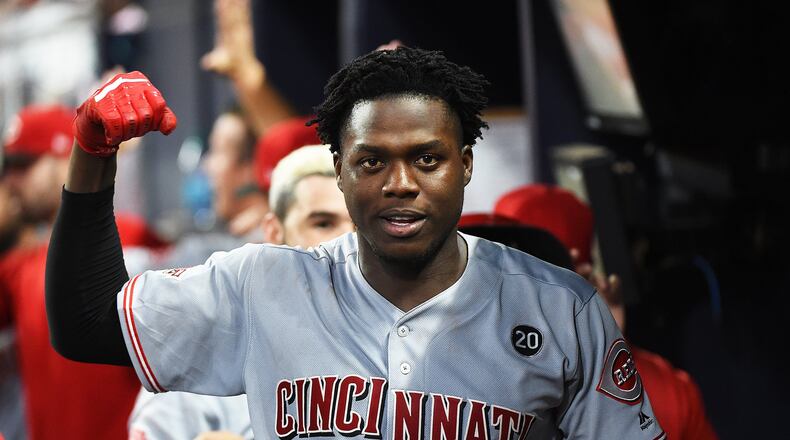 Aristides Aquino of the Cincinnati Reds celebrates after hitting game tying 3-run home run against the host Atlanta Braves at SunTrust Park on Saturday, Aug. 23, 2019. (Photo by Logan Riely/Getty Images)
