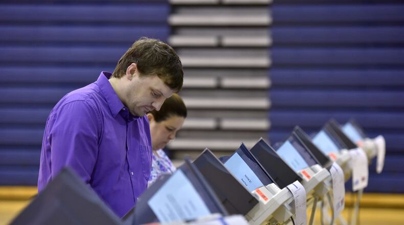 Trenton councilman Ryan Montgomery votes at Edgewood Middle School Tuesday, March 15. NICK GRAHAM/STAFF