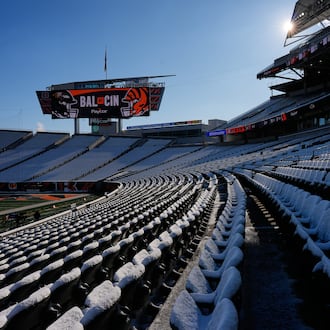 Stadium seats are covered in snow before an NFL football game between the Cincinnati Bengals and the Baltimore Ravens, Sunday, Dec. 14, 2025, in Cincinnati. (AP Photo/Carolyn Kaster)