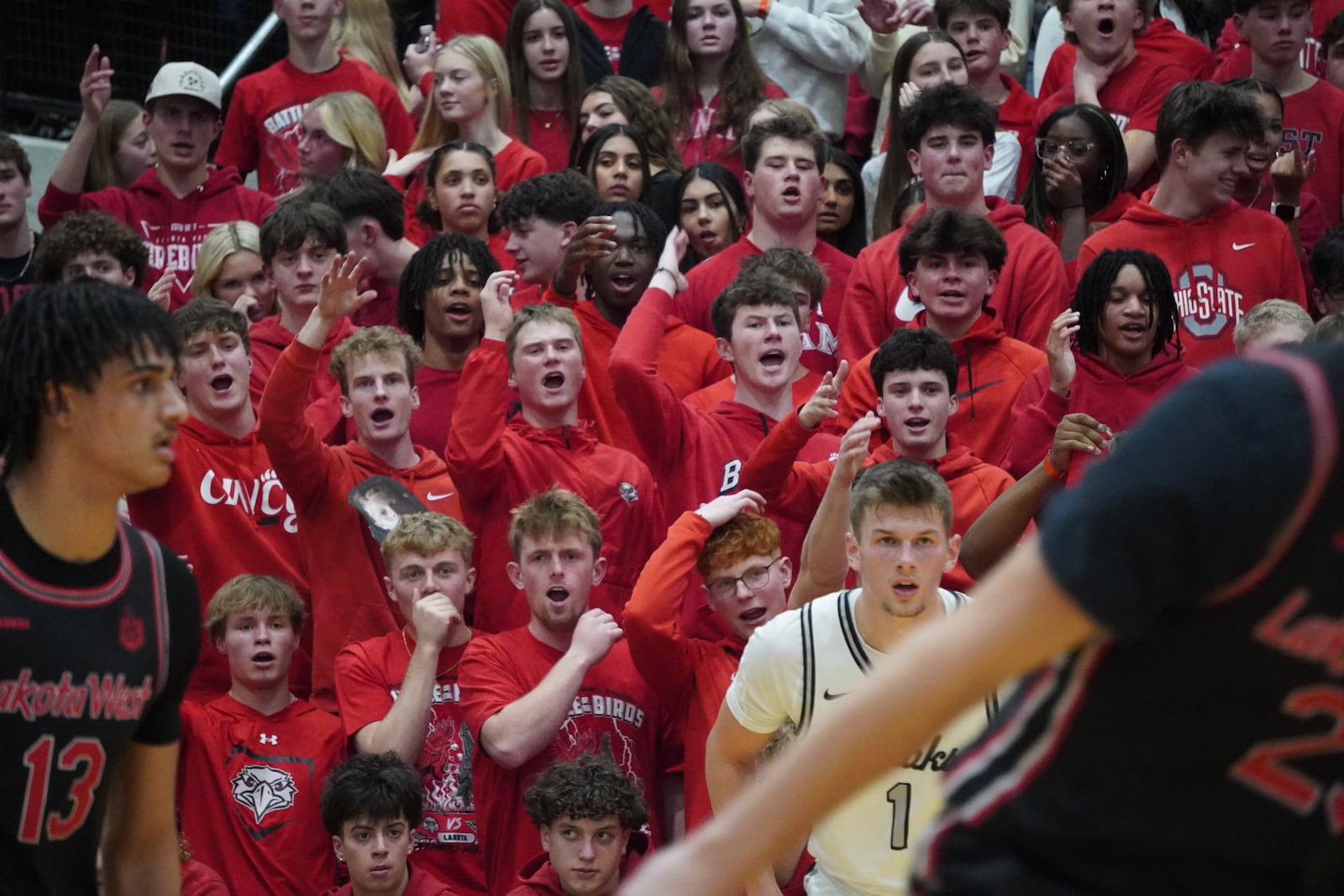 The Lakota West student section cheers loudly during the Firebirds’ game against Lakota East on Friday night. CHRIS VOGT / CONTRIBUTED