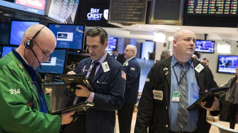 Traders on the floor of the New York Stock Exchange. (Photo by Drew Angerer/Getty Images)