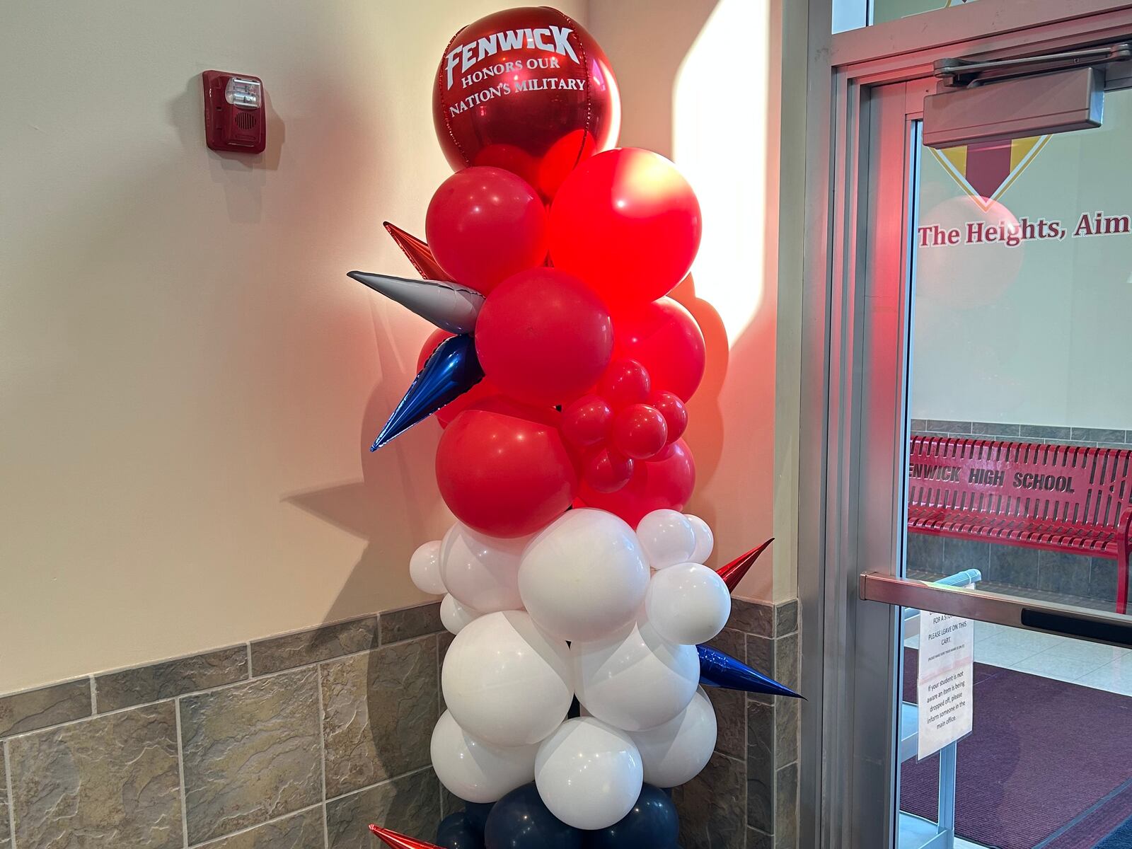 Veterans and active duty military were greeted by balloons Friday morning at Fenwick High School. RICK McCRABB