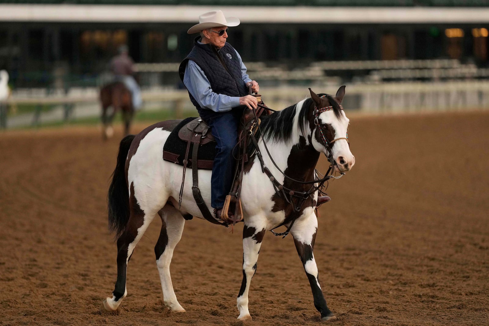 FILE - Trainer D. Wayne Lukas watches a workout at Churchill Downs May 1, 2025, in Louisville, Ky. (AP Photo/Charlie Riedel, File)