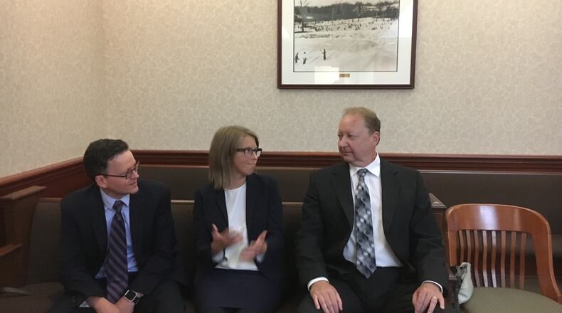 Fired Butler County Regional Airport manager Ron Davis sits between his attorneys Erin Heidrich and George Reul during a hearing in Common Pleas Judge Keith Spaeth’s courtroom. Davis has sued the county to get his his $94,000 job back.