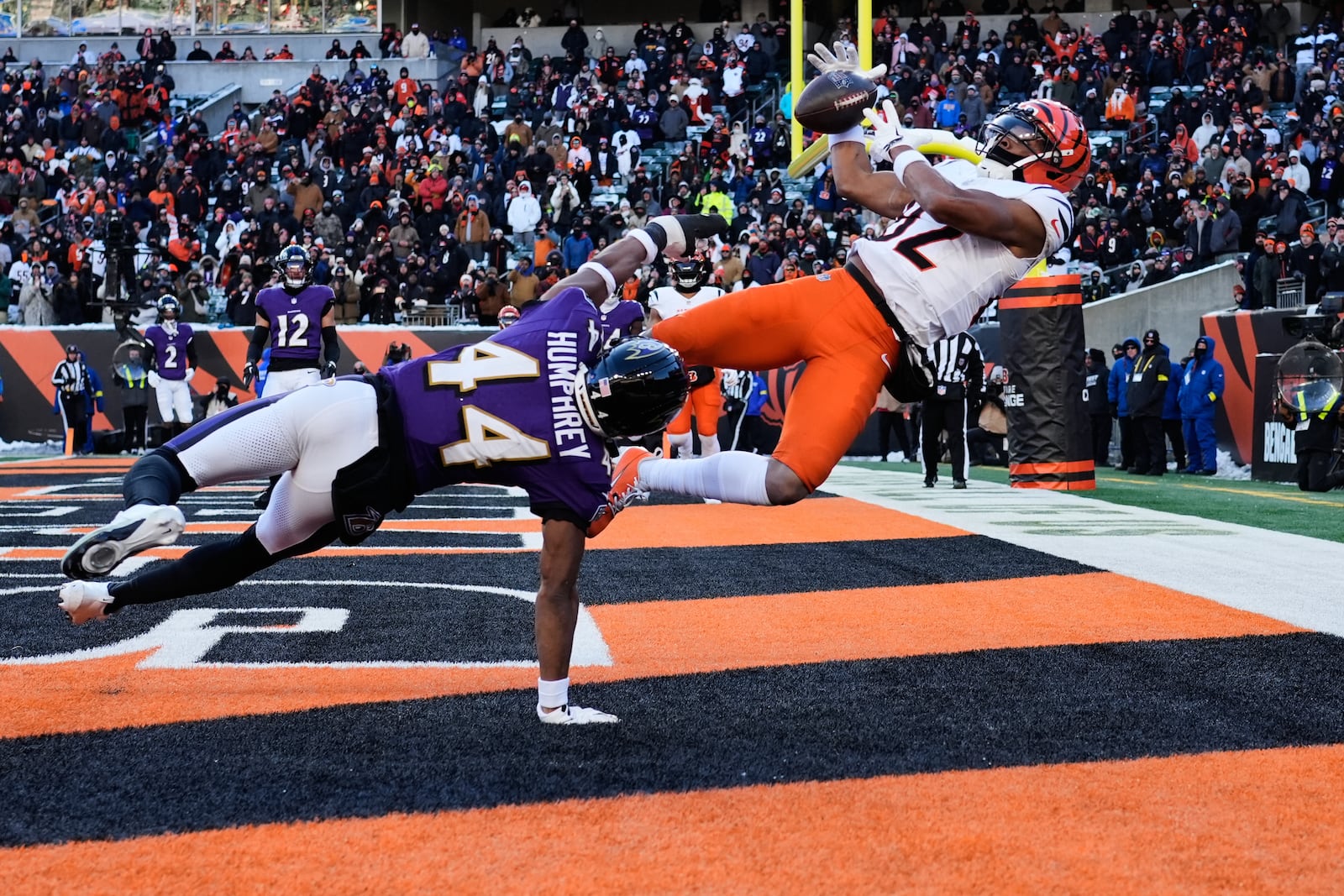 Baltimore Ravens cornerback Marlon Humphrey (44) breaks up a pass intended for Cincinnati Bengals wide receiver Mitchell Tinsley (82) during the second half of an NFL football game, Sunday, Dec. 14, 2025, in Cincinnati. (AP Photo/Carolyn Kaster)