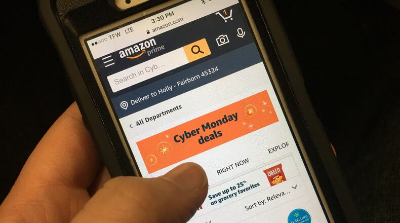 As 75 million shoppers look for deals online, employers realize it’s happening at work. STAFF PHOTO / HOLLY SHIVELY