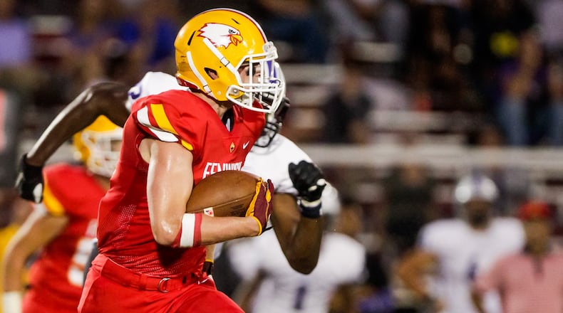 Fenwick’s Ralph Ross runs the ball during their football game against St. Francis DeSales Friday, Sept. 27 at Bishop Fenwick High School. St. Francis DeSales won 42-22. NICK GRAHAM/STAFF