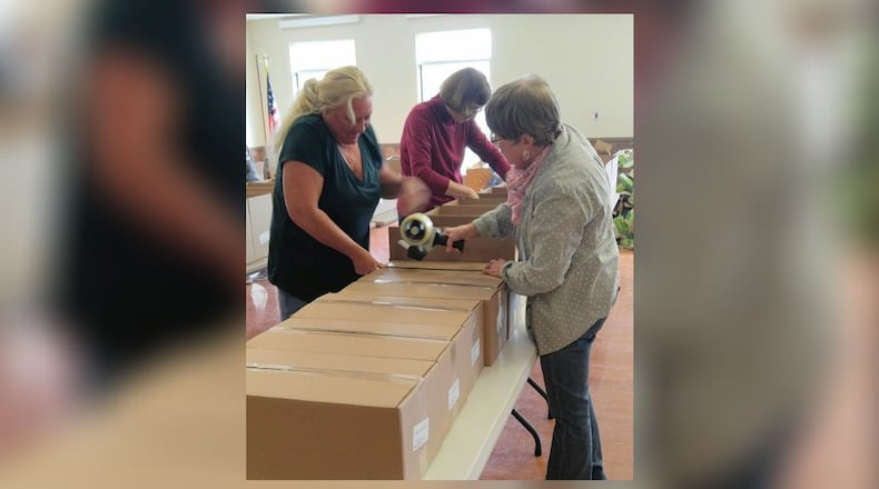 Central Connections, the senior center in Middletown, is closed for regular programming due to the pandemic but is continuing to provide services to older adults. On Tuesday, a crew of members, community volunteers, and staff packed 530 14-day shelf-stable meal boxes for the center s home delivered meal clients in Butler and Warren counties a total of 7,392 meals. Another food box packing effort will occur when another supply shipment arrives, according to the senior center. CONTRIBUTED/CENTRAL CONNECTIONS