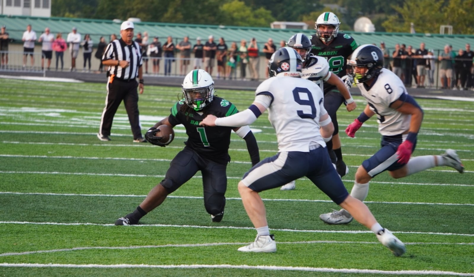 Badin's Lem Grayson rushes while Edgewood's Carter Breedlove goes after the tackle during their game on Friday at the Matandy SportsPlex. MATT VOGT / CONTRIBUTED
