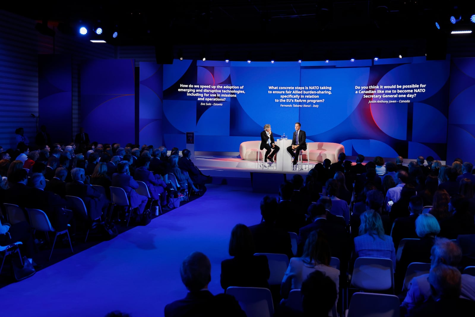 NATO Secretary General Mark Rutte, center right, addresses the audience at the NATO public forum on the sidelines of the NATO summit in The Hague, Netherlands, Tuesday, June 24, 2025. (AP Photo/Geert Vanden Wijngaert)