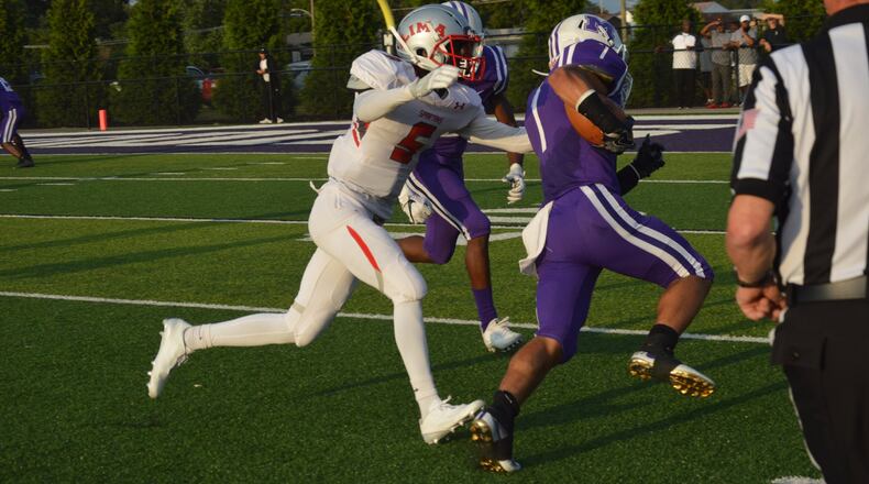 Lima Senior’s Kevontae Tyson (5) comes after Middletown’s Blake Marshall during last Friday night’s game at Barnitz Stadium in Middletown. The visiting Spartans won 34-14. CONTRIBUTED PHOTO BY MARITZA MCKINNEY