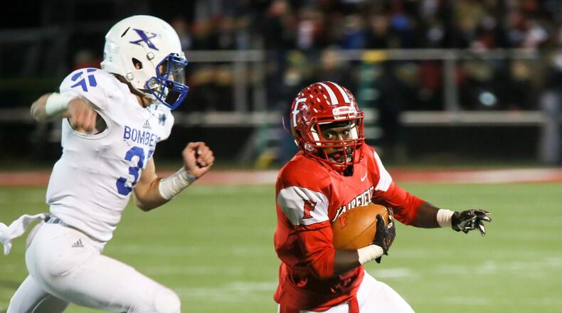Fairfield receiver Raqwon Williams (4) looks up field during their Division I, Region 4 playoff game against St. Xavier at Fairfield Stadium on Friday night. GREG LYNCH/STAFF