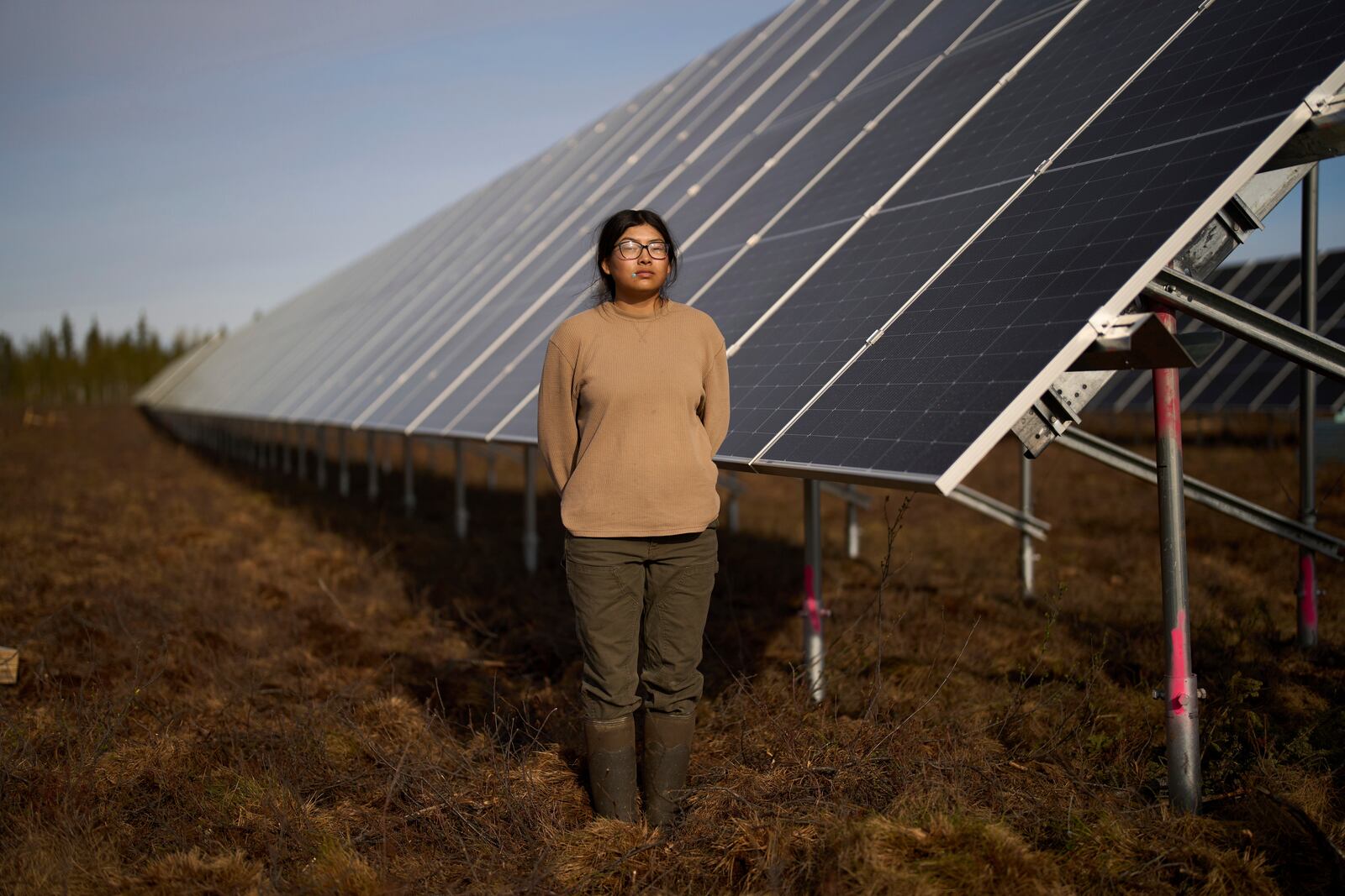 Jade Thurmond poses for a portrait at a construction site of a solar energy project Friday, May 23, 2025, in Galena, Alaska. (AP Photo/John Locher)