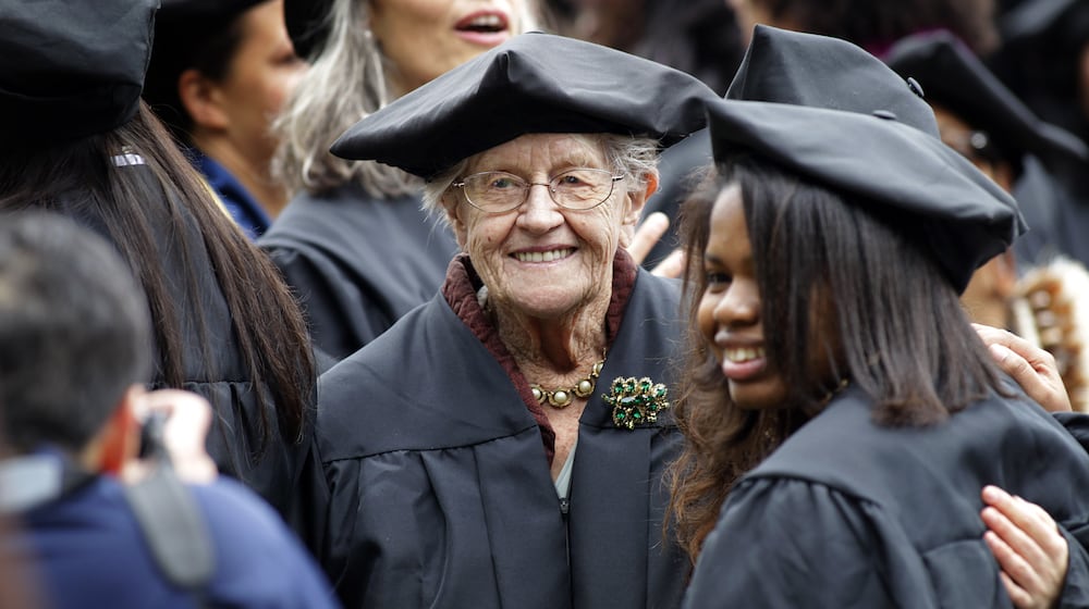 FILE - Hazel Soares, 94, center, gets her picture taken with some of her classmates before the start of commencement exercises at Mills College, in Oakland, Calif., Saturday, May 15, 2010. ( AP Photo/Tony Avelar, File)