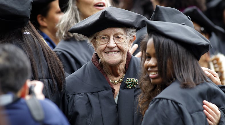 FILE - Hazel Soares, 94, center, gets her picture taken with some of her classmates before the start of commencement exercises at Mills College, in Oakland, Calif., Saturday, May 15, 2010. ( AP Photo/Tony Avelar, File)