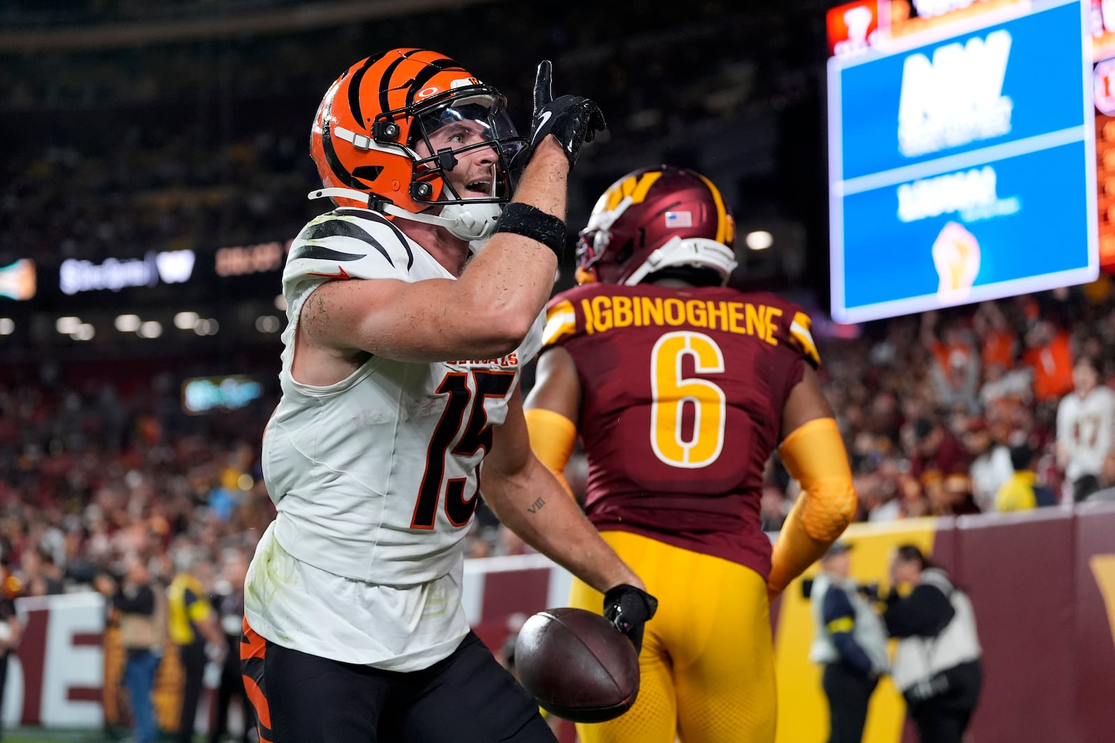 Cincinnati Bengals wide receiver Charlie Jones (15) celebrates after scoring during the first half of a preseason NFL football game against the Washington Commanders Monday, Aug. 18, 2025, in Landover, Md. (AP Photo/Stephanie Scarbrough)
