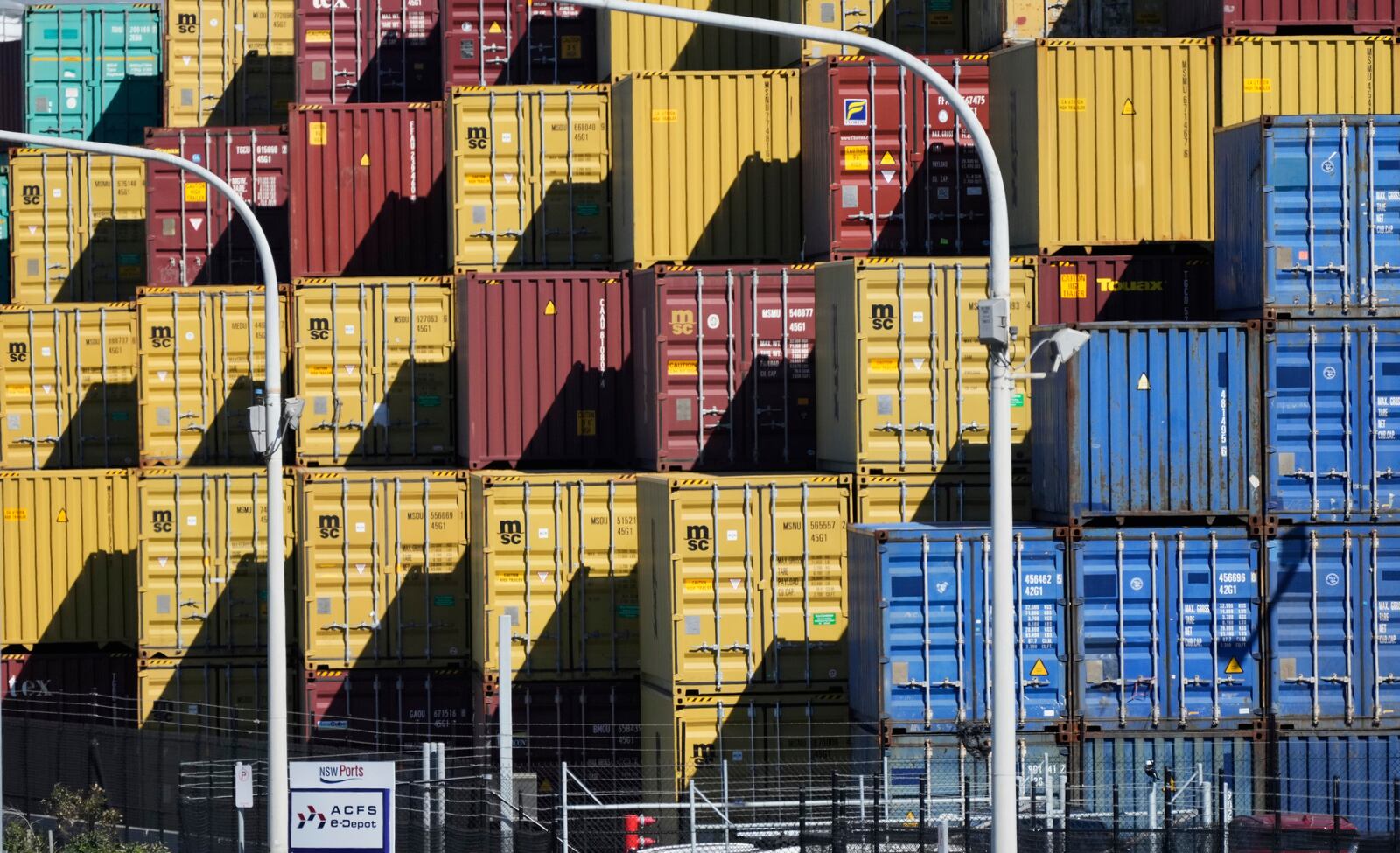 Shipping containers are stacked at Port Botany in Sydney, Australia, Monday, April 7, 2025. (AP Photo/Rick Rycroft)