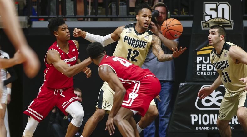 WEST LAFAYETTE, IN - JANUARY 16: Vincent Edwards #12 of the Purdue Boilermakers reaches for the ball against Aleem Ford #2 of the Wisconsin Badgers at Mackey Arena on January 16, 2018 in West Lafayette, Indiana. (Photo by Michael Hickey/Getty Images)