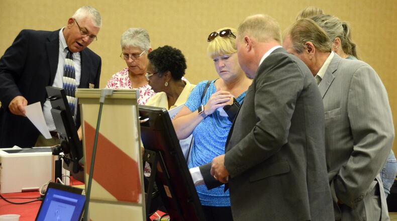 A couple hundred people came to the Butler County Board of Elections office on July 26 to test six voting machines from five vendors. The elections office is looking to replace its machines from 2005, but the price tag could cost taxpayers between $3 million and $6 million. MICHAEL D. PITMAN/STAFF