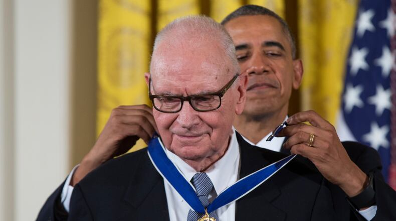 FILE - President Barack Obama, right, presents the Presidential Medal of Freedom to former Rep. Lee Hamilton, D-Ind., during a ceremony in the East Room of the White House, Nov. 24, 2015, in Washington. (AP Photo/Evan Vucci, File)