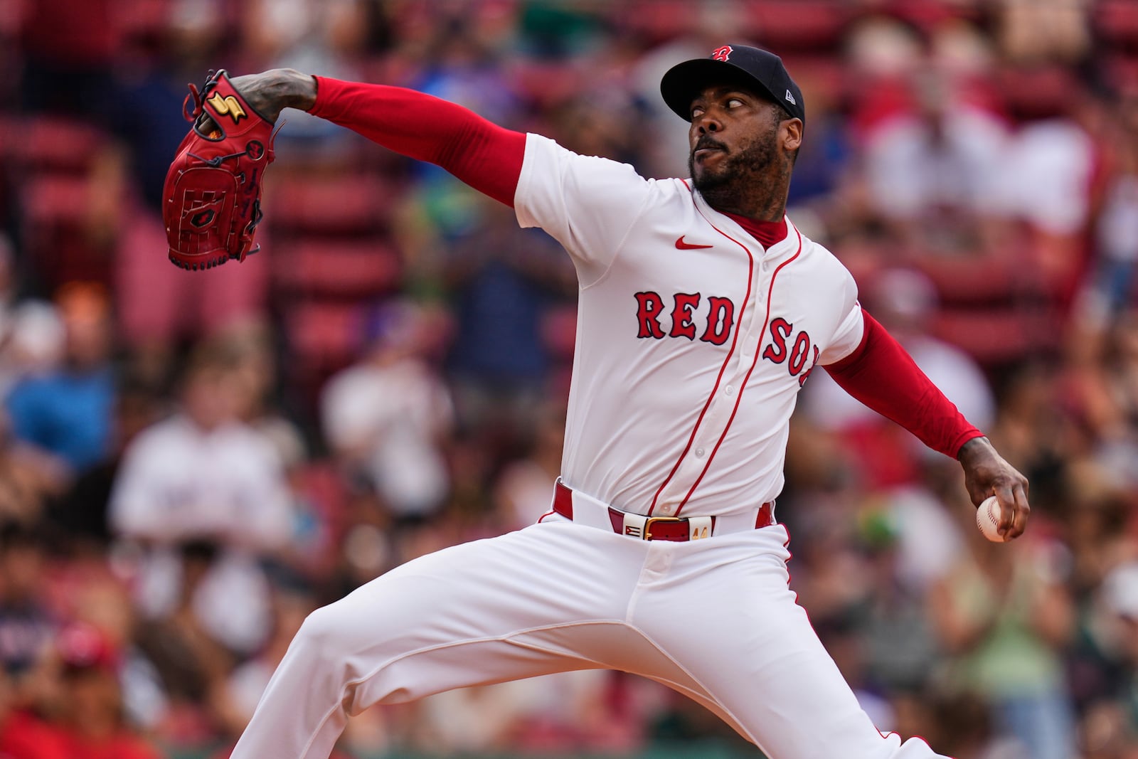 Boston Red Sox pitcher Aroldis Chapman delivers against the Cincinnati Reds during the ninth inning of a baseball game, a continuation of a game the night before which was suspended due to rain, Wednesday, July 2, 2025, at Fenway Park, in Boston. (AP Photo/Charles Krupa)
