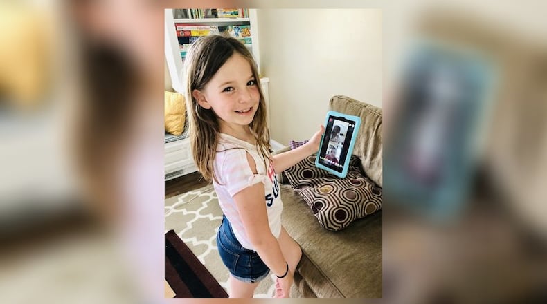 Laura Meder, 7, shows how she stays connected with her friends by using Facebook messenger. SUBMITTED PHOTO