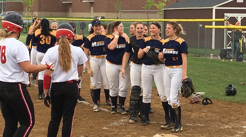 Monroe pitcher Alyssa Wagner (21) leads the Hornets’ handshake line after their 5-0 victory over Franklin on Wednesday in a Division II district semifinal at Lebanon. RICK CASSANO/STAFF