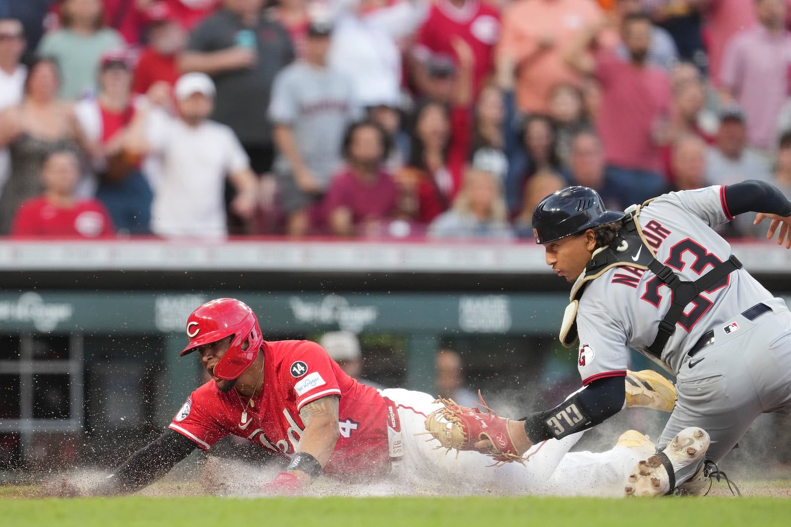 Cincinnati Reds' Santiago Espinal (4) on a double hit by Austin Hays during the sixth inning of a baseball game against the Cleveland Guardians, Saturday, May 17, 2025, in Cincinnati. (AP Photo/Jeff Dean)