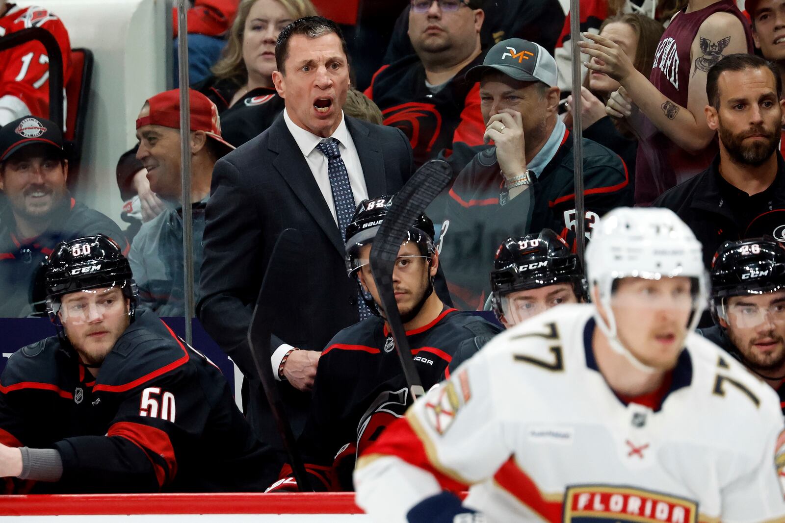 Carolina Hurricanes head coach Rod Brind'Amour watches from the bench during the first period of Game 1 of the NHL hockey Stanley Cup Eastern Conference finals against the Florida Panthers in Raleigh, N.C., Tuesday, May 20, 2025. (AP Photo/Karl DeBlaker)