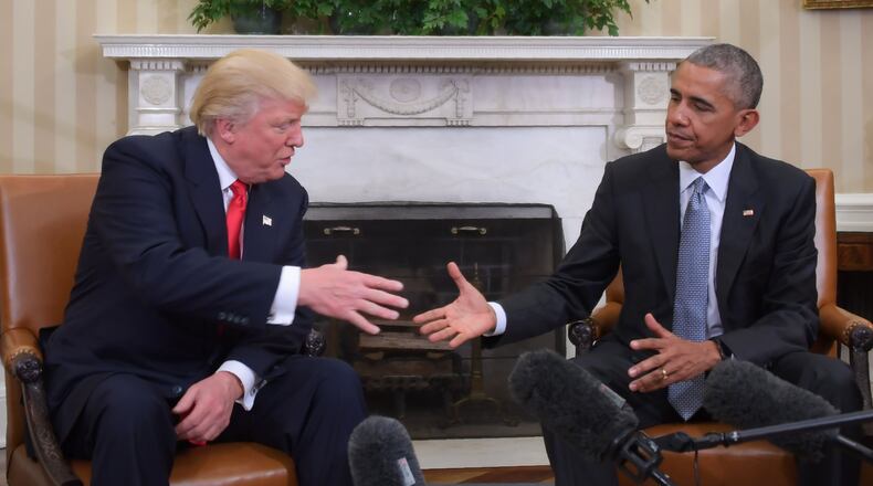 Former President Barack Obama and Republican President-elect Donald Trump shake hands during a transition planning meeting in the Oval Office at the White House on Nov. 10, 2016 in Washington, D.C.