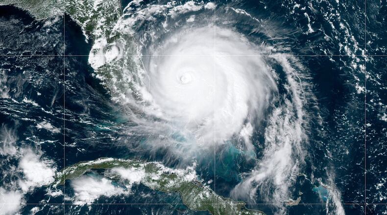 ATLANTIC OCEAN - SEPTEMBER 2: In this NOAA GOES-East satellite handout image, Hurricane Dorian, now a Cat. 4 storm, moves slowly past Grand Bahama Island on September 2, 2019 in the Atlantic Ocean. Dorian moved slowly past the Bahamas at times just 1 mph as it unleashed massive flooding and winds of 150 m.p.h. (Photo by NOAA via Getty Images) *** BESTPIX ***