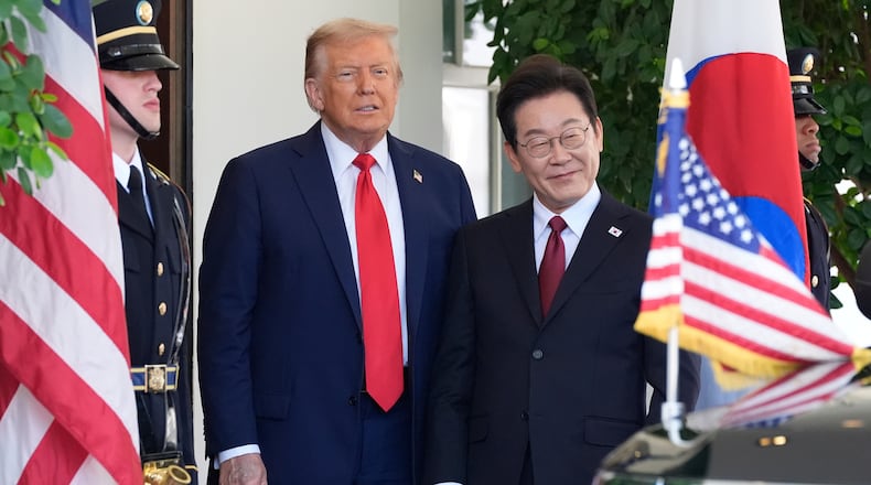 FILE - President Donald Trump, left, greets South Korean President Lee Jae Myung upon his arrival at the White House, on Aug. 25, 2025, in Washington. (AP Photo/Alex Brandon, File)
