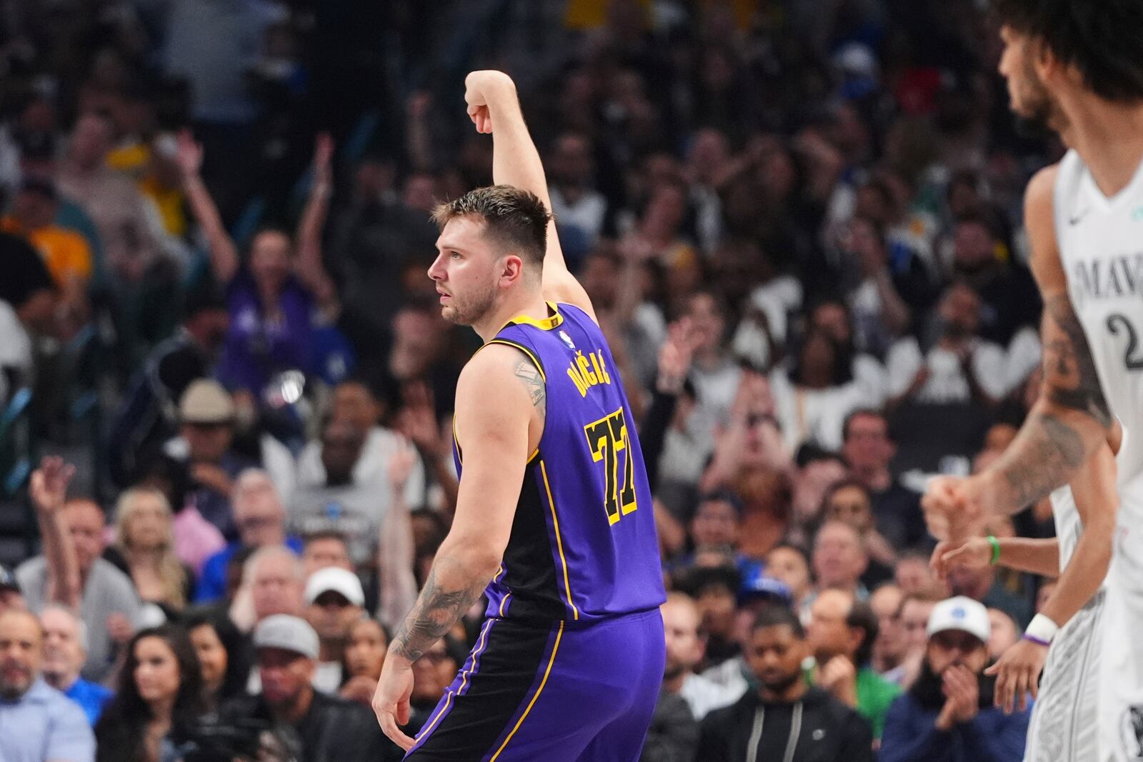 Los Angeles Lakers' Luka Doncic follows through on a shot in the first half of an NBA basketball game against the Dallas Mavericks in Dallas, Wednesday, April 9, 2025. (AP Photo/LM Otero)