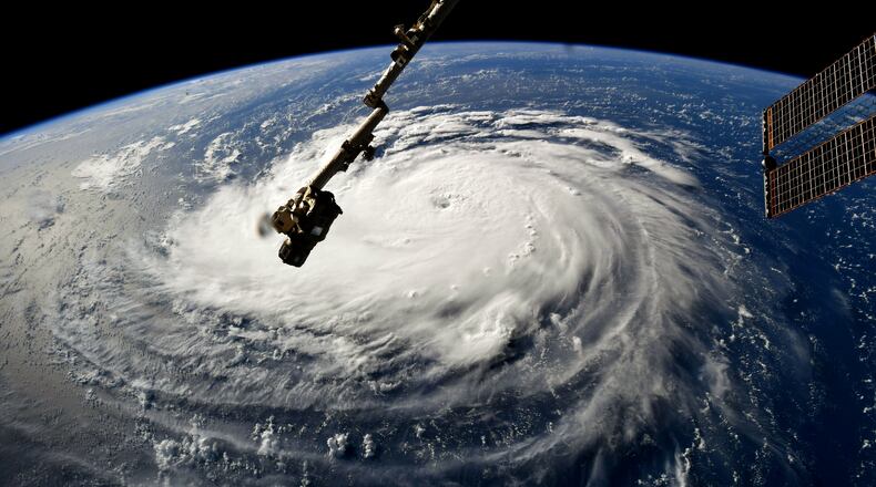 In this NASA handout image taken by Astronaut Ricky Arnold, Hurricane Florence gains strength in the Atlantic Ocean as it moves west, seen from the International Space Station on Monday. (Photo by NASA via Getty Images)